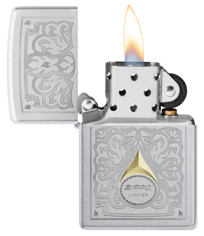 Zippo Vintage Filigree Design Satin Chrome Windproof Lighter with its lid open and lit.