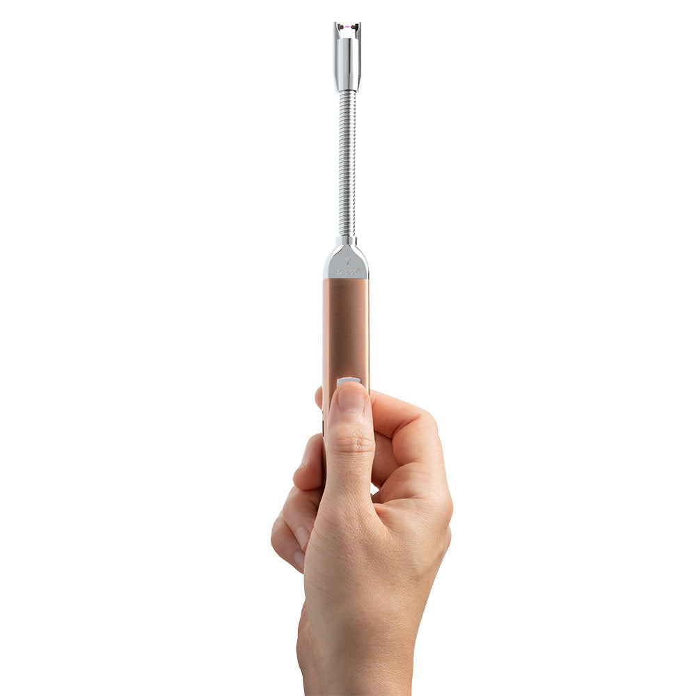 Rechargeable Candle Lighter Rose Gold lit in hand