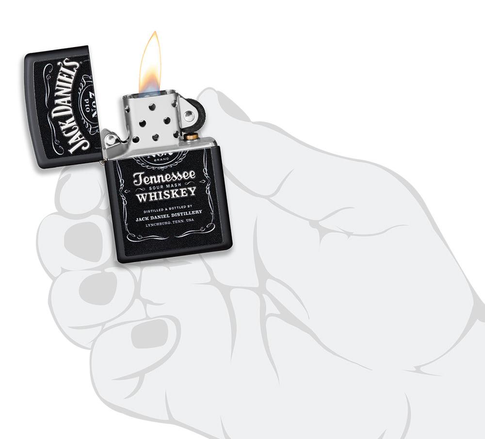 Jack Daniel'sÂ® Texture Print Black Matte Windproof Lighter lit in hand